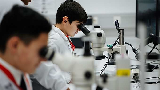 Caritas learning cafe children in a lab