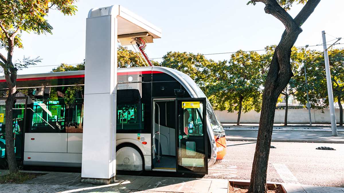 woman waiting at busstop