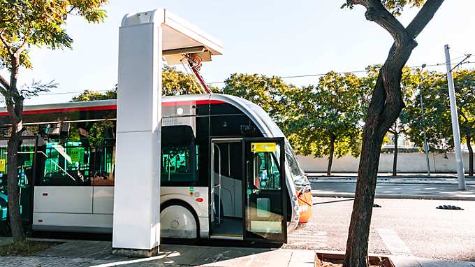 woman waiting at busstop