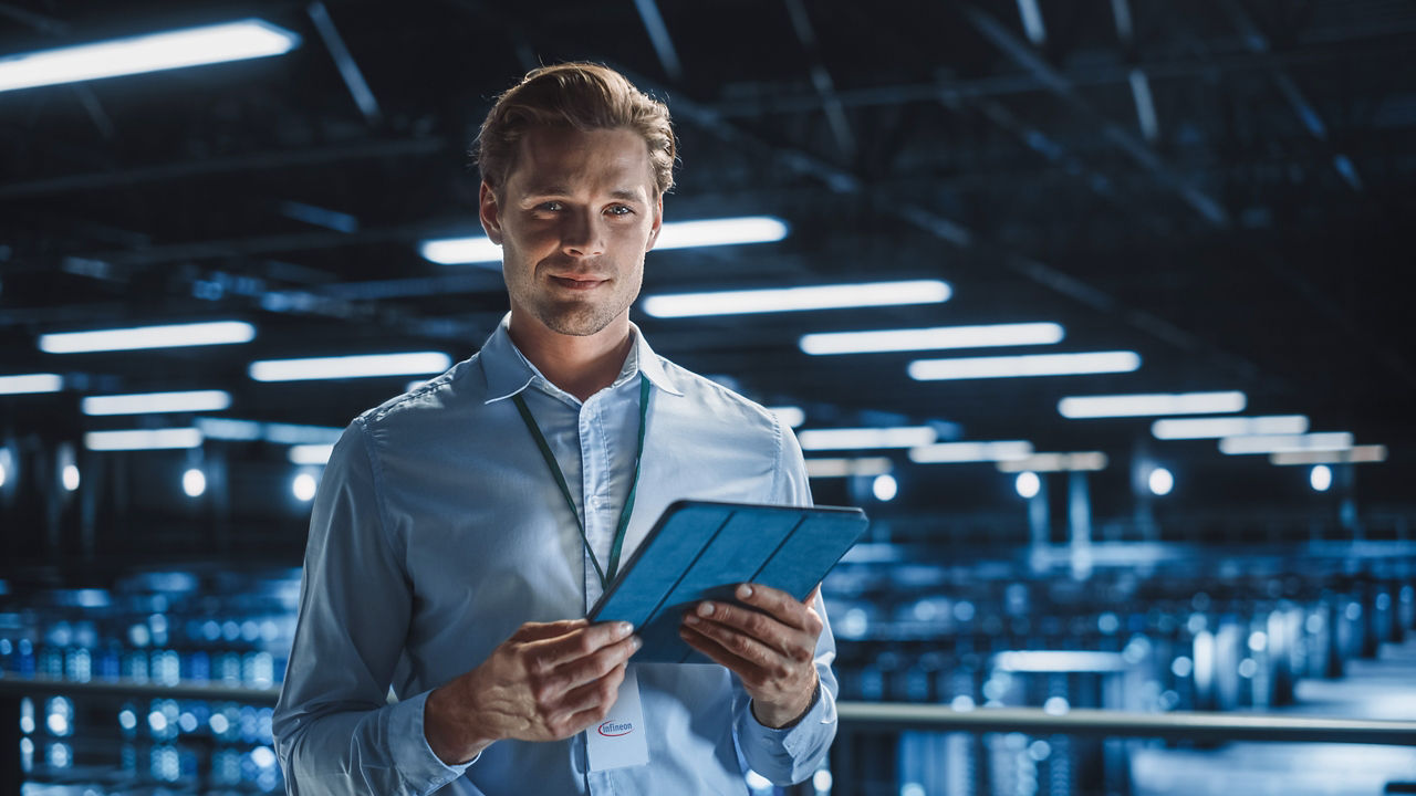 Man with a tablet in ai data center