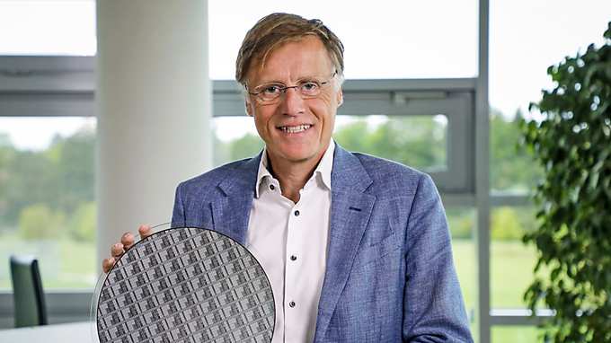 Infineon CEO Jochen Hanebeck with one of the first 300 mm GaN power wafers