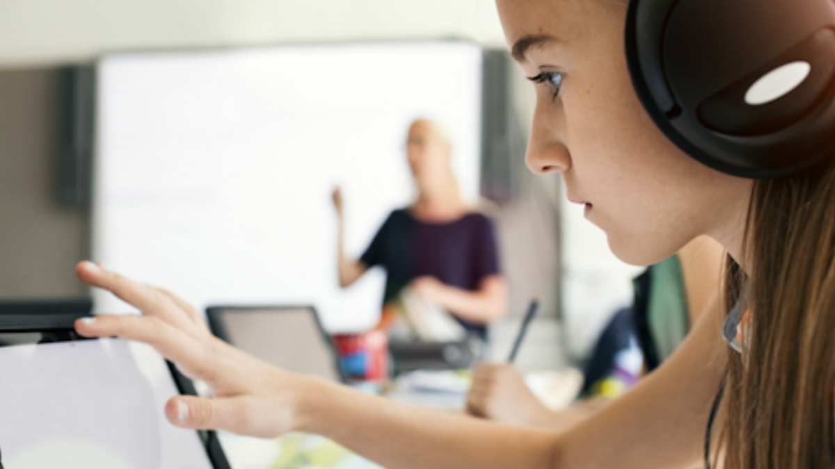 Students studying in front tablet