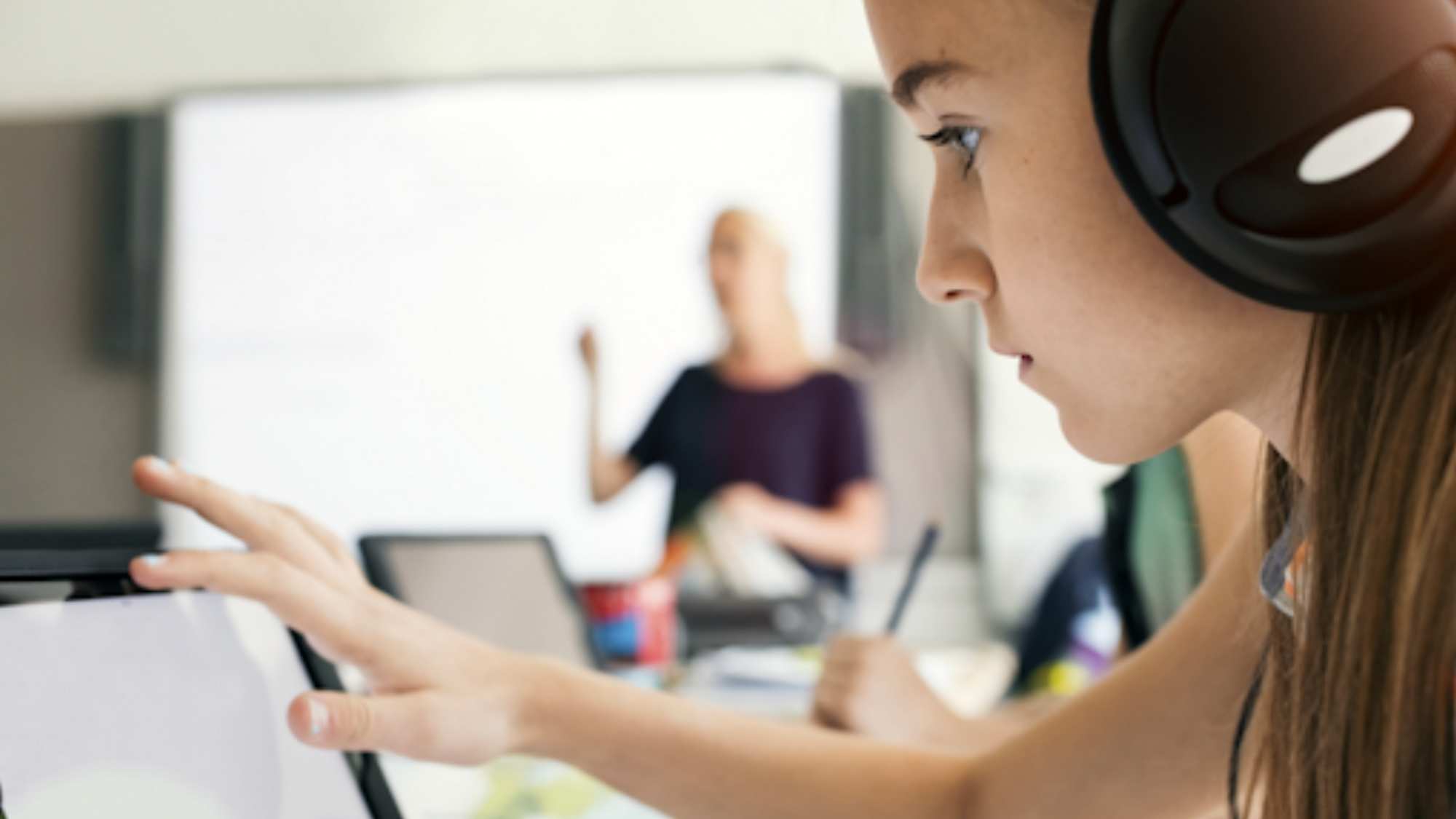 Students studying in front tablet