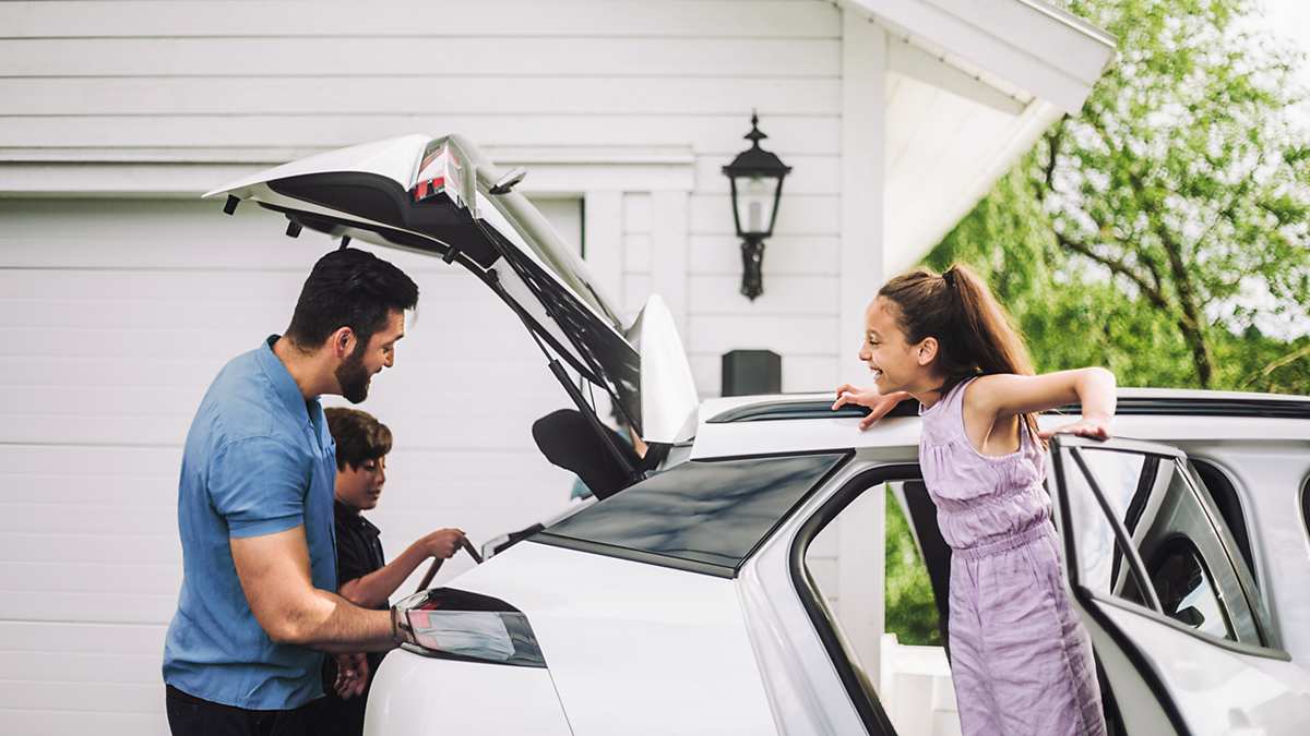 Father loading stuff in car