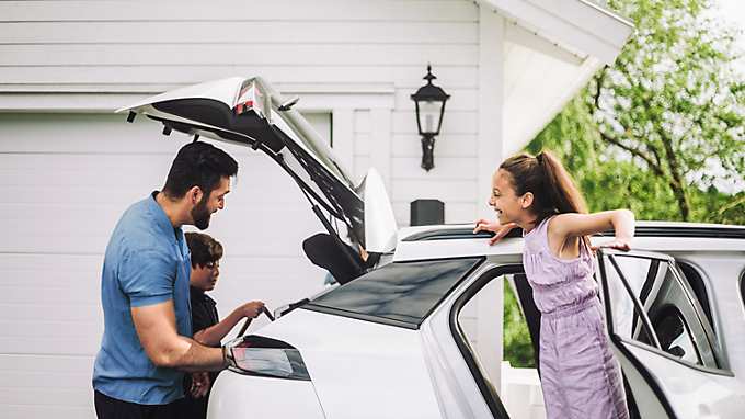 Father loading stuff in car