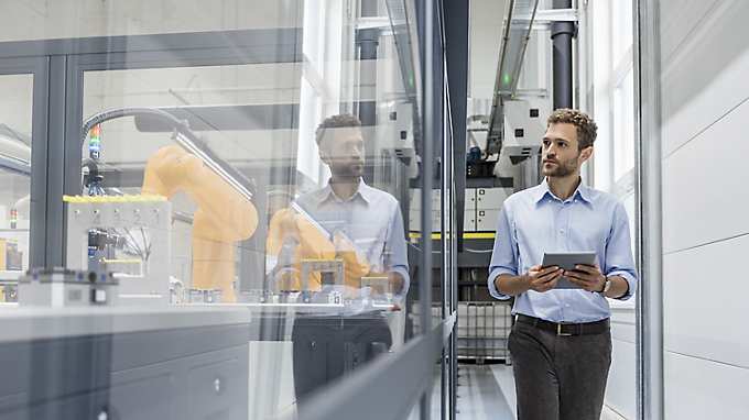 man with tablet in smart factory