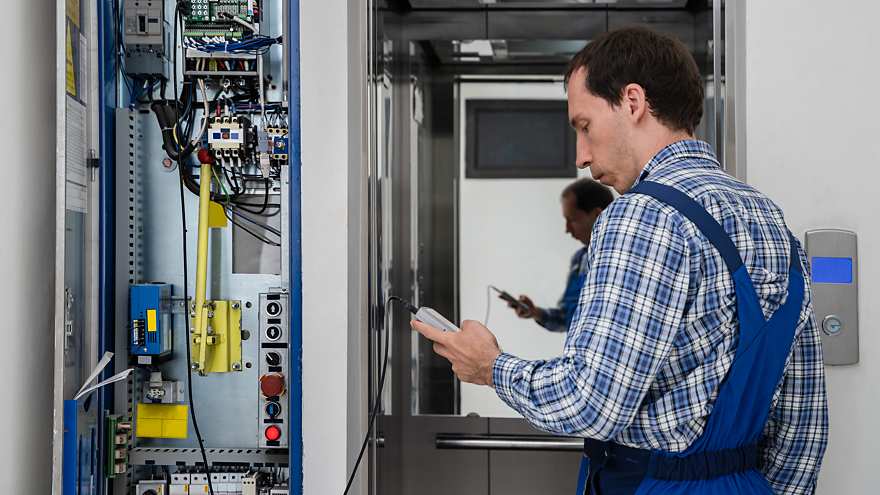 Technician repairing an elevator