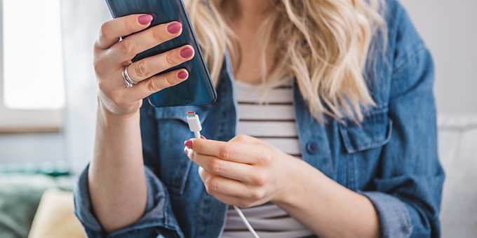 woman with smartphone charger